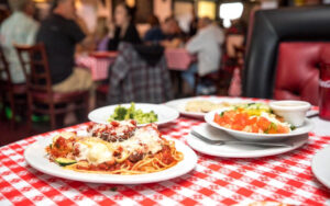 delicious looking italian dinner served on a red and white checkered table in Hermosa Beach CA